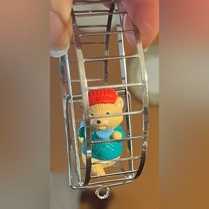 Hallmark hamster on a wheel spins red cap green shirt